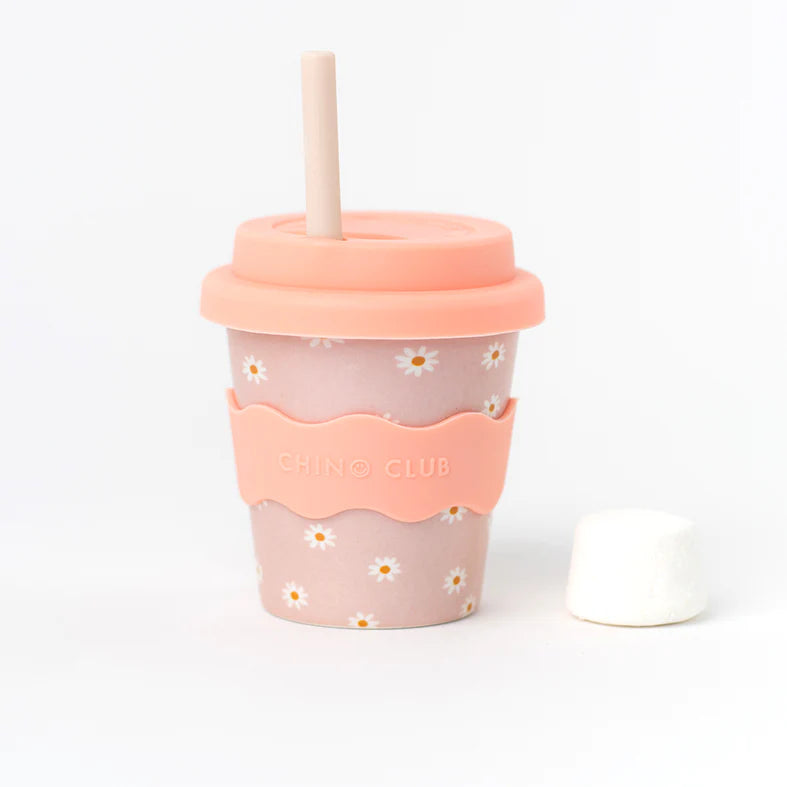 Pink daisy babychino cup with lid and light-colored straw, 4 oz