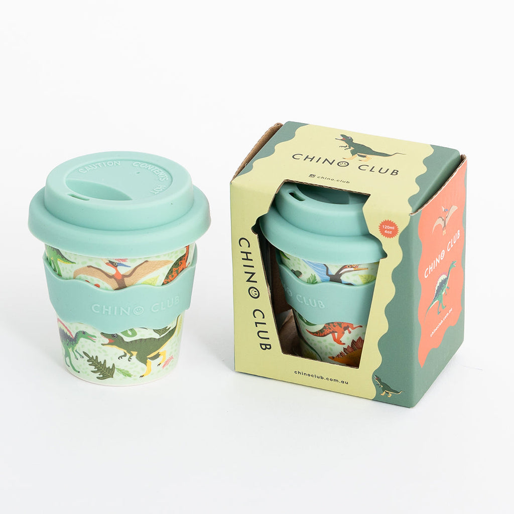 Light green dino babychino cup with snap lid and straw, shown in gift box