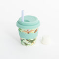 Mint drink cup with dinosaur print, lidded straw, and 