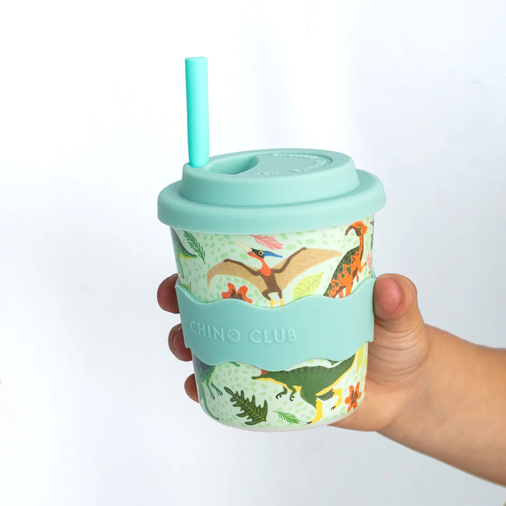 Mint green reusable keep cup with dinosaur print, flip-top lid and teal straw