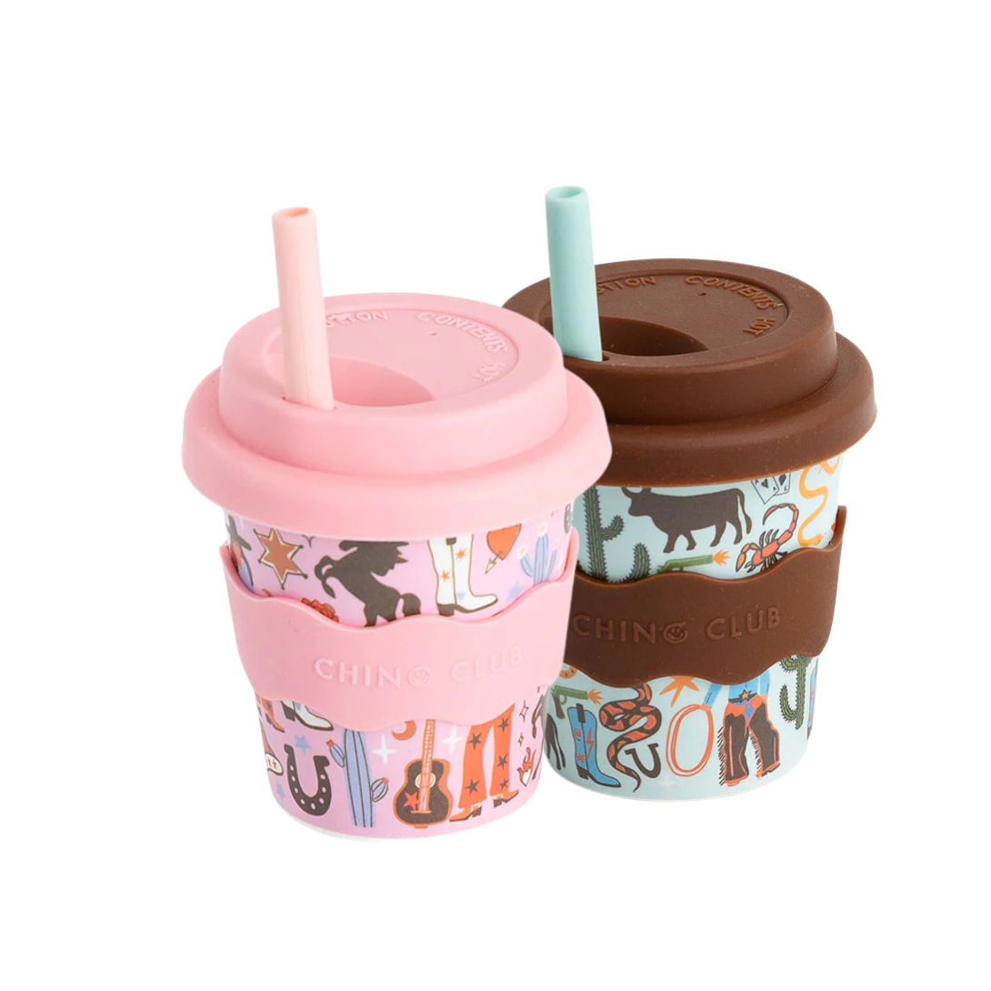 Pair of patterned to-go cups, pink and brown, each with lid and straw