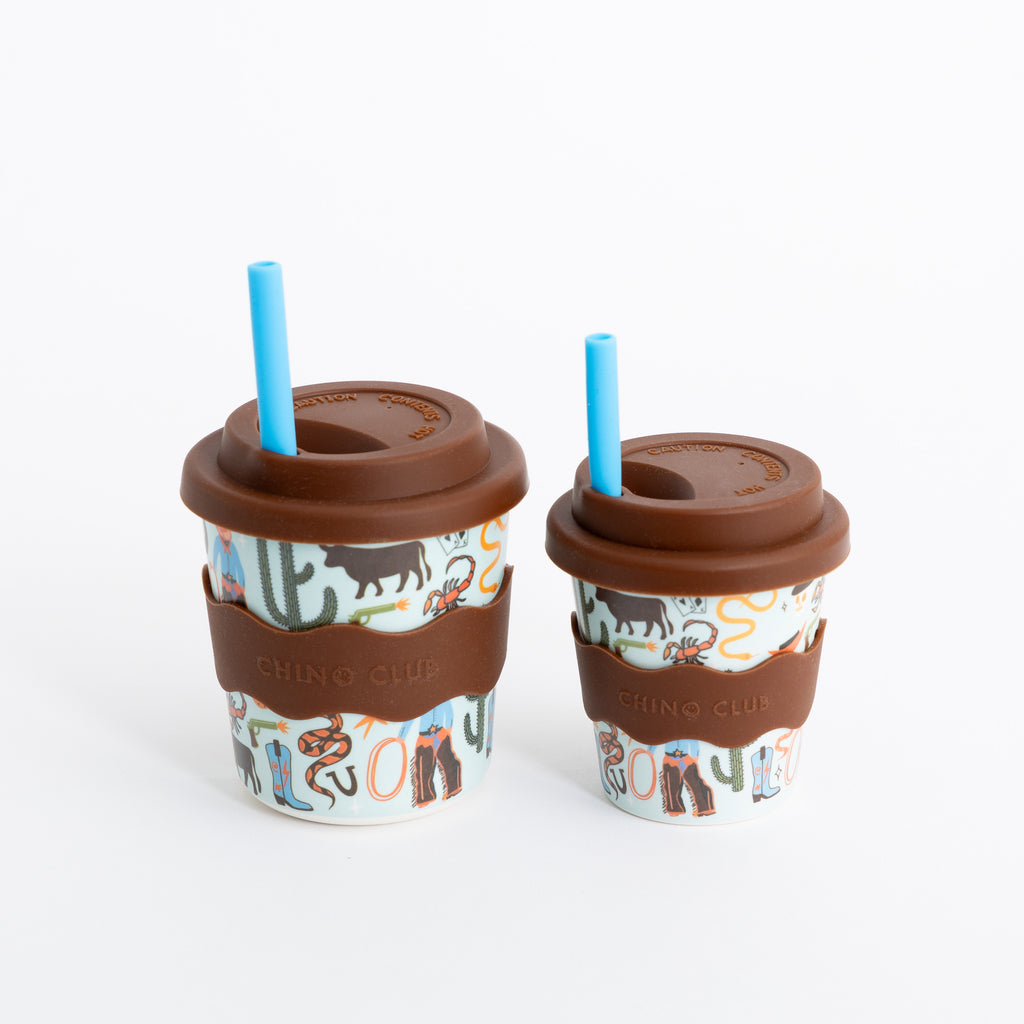 Two 8oz keep cups with brown lids and blue straws, cactus and cowboy print
